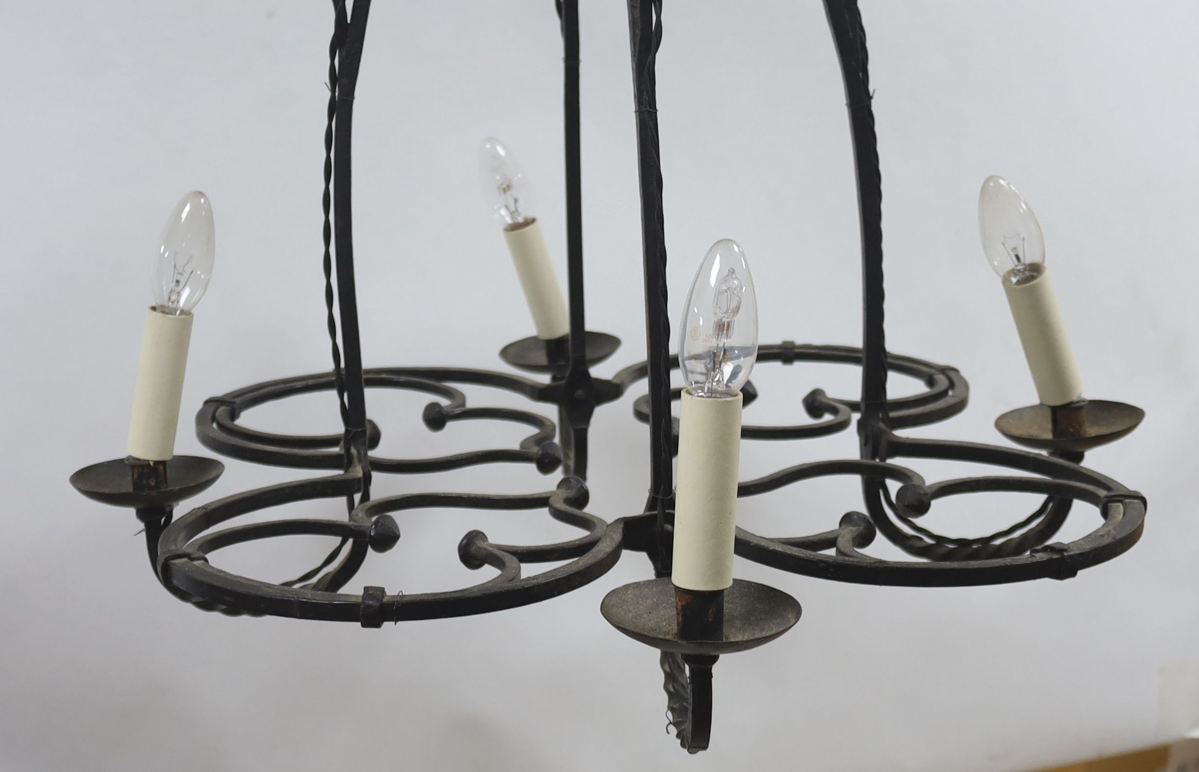 A wrought iron 4 light chandelier 80x63cm